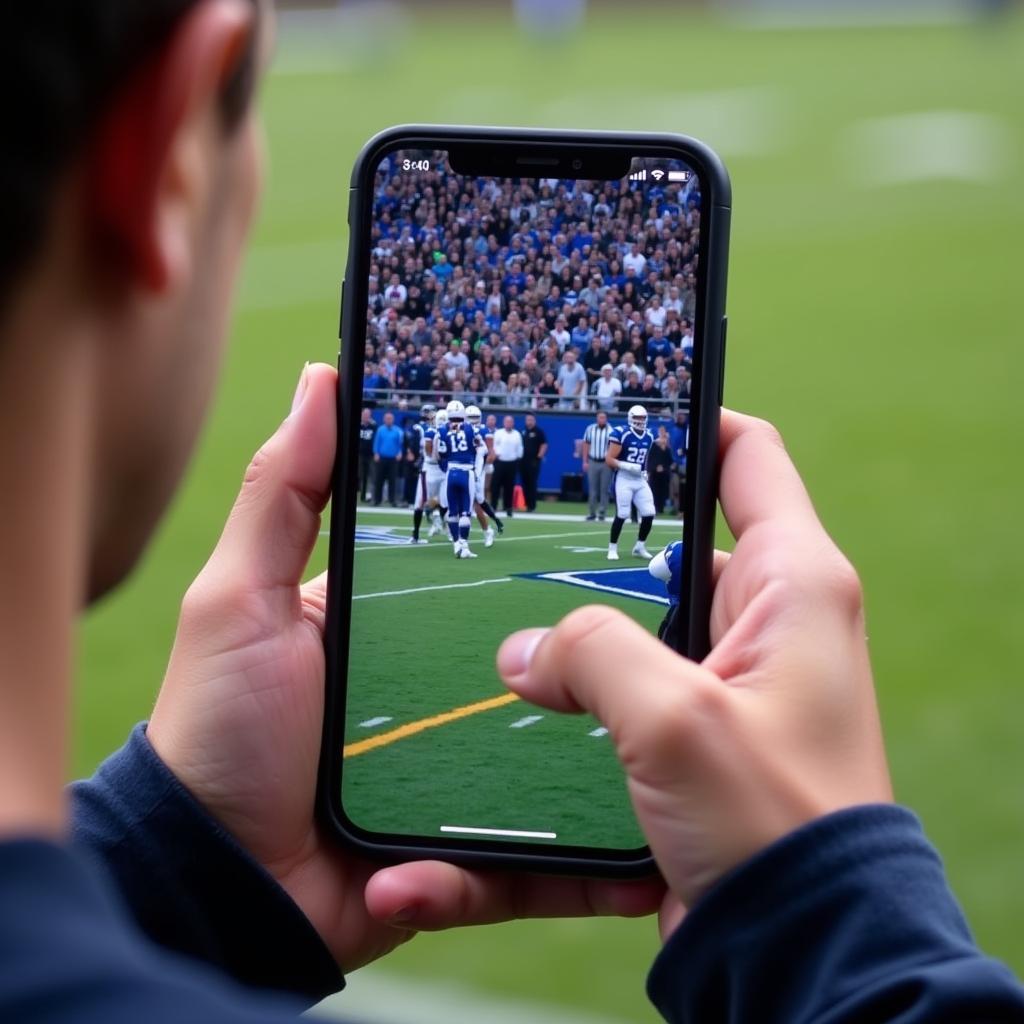 Watching Butte High School football live stream on a smartphone