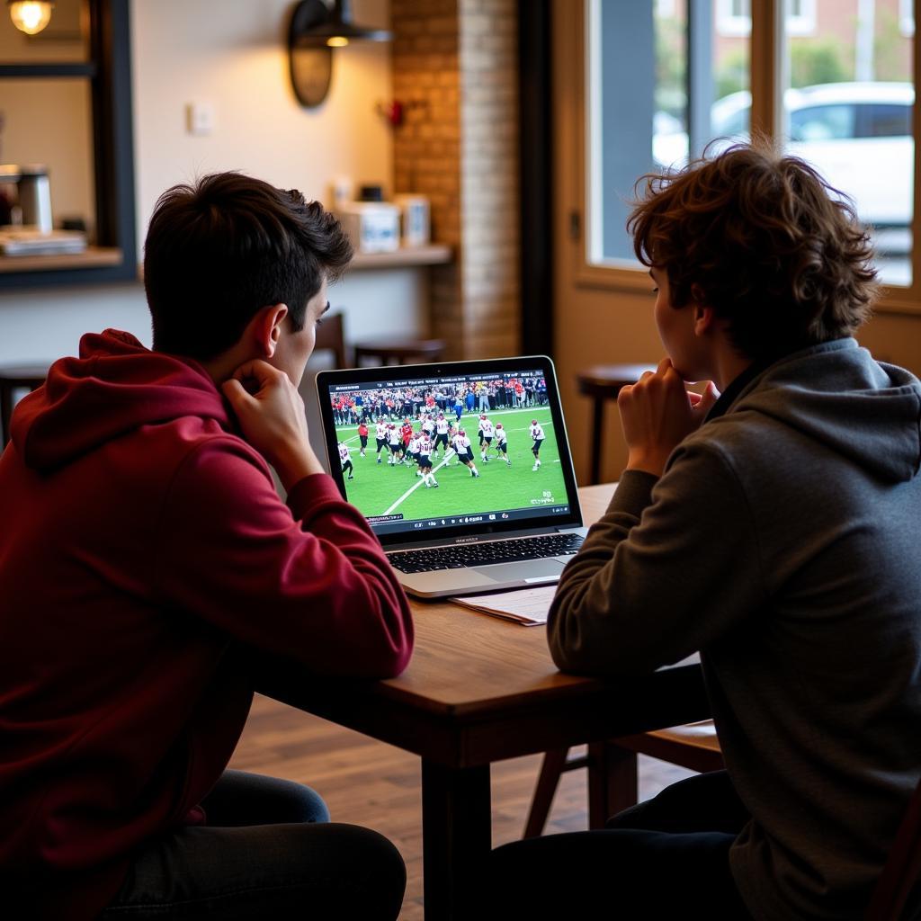 Eastbrook High School Football Live Stream: Students Watching Game on Laptop