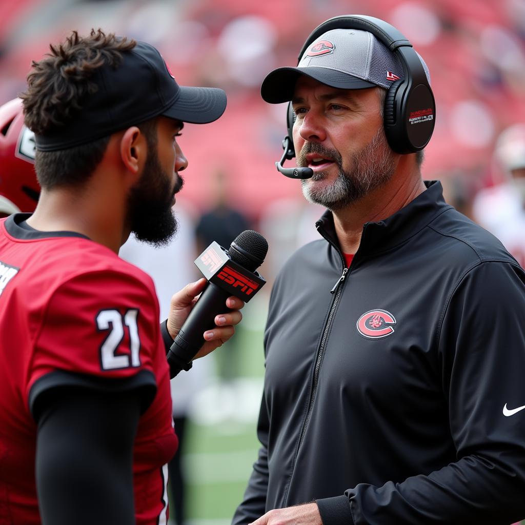 ESPN College Football Analyst Interviewing Player