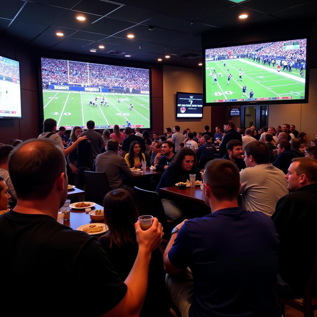 Fans watching a Cowboys game at a sports bar