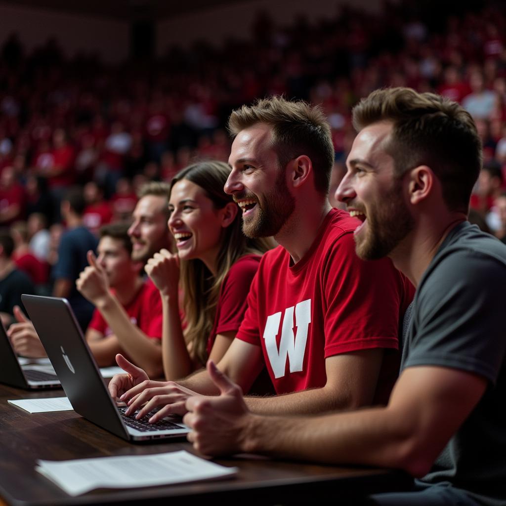 Wisconsin Badgers Fans Watching Game on Laptop