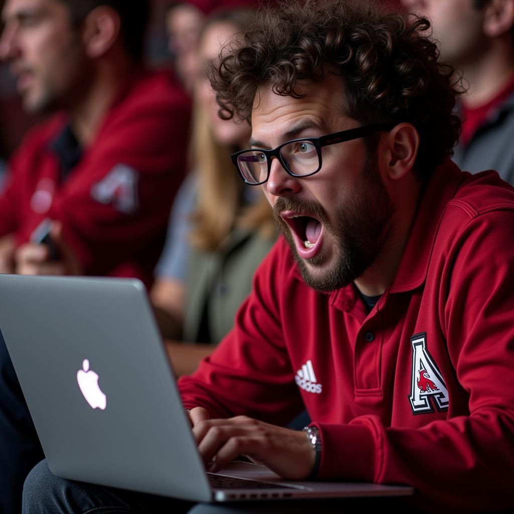 Arkansas State Football Fan Watching Live Stream