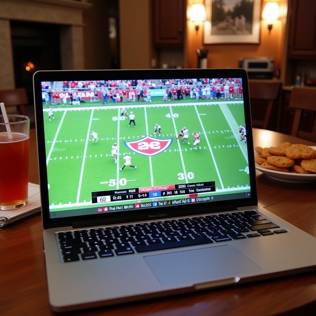 Watching Austin College Football live stream on a laptop