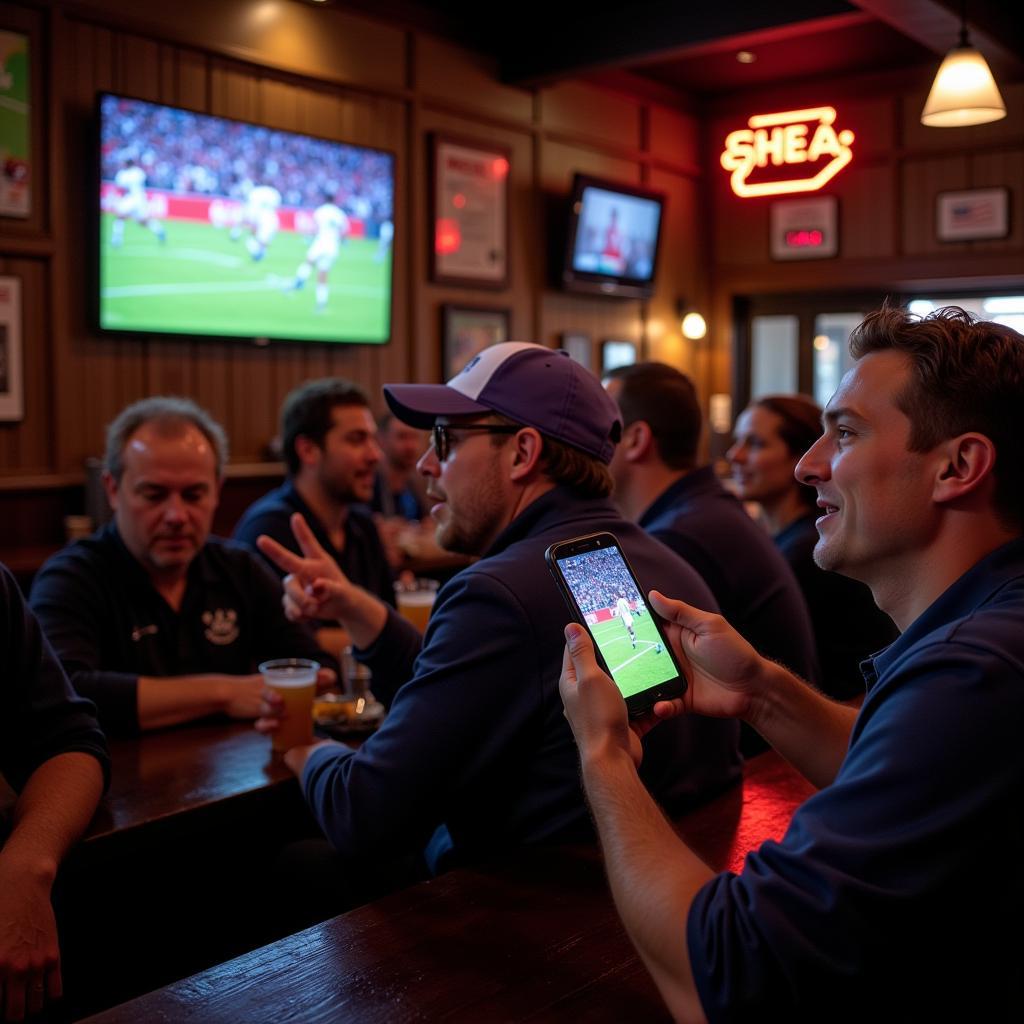 Celina High School Football Fans Watching Live Stream on Phone