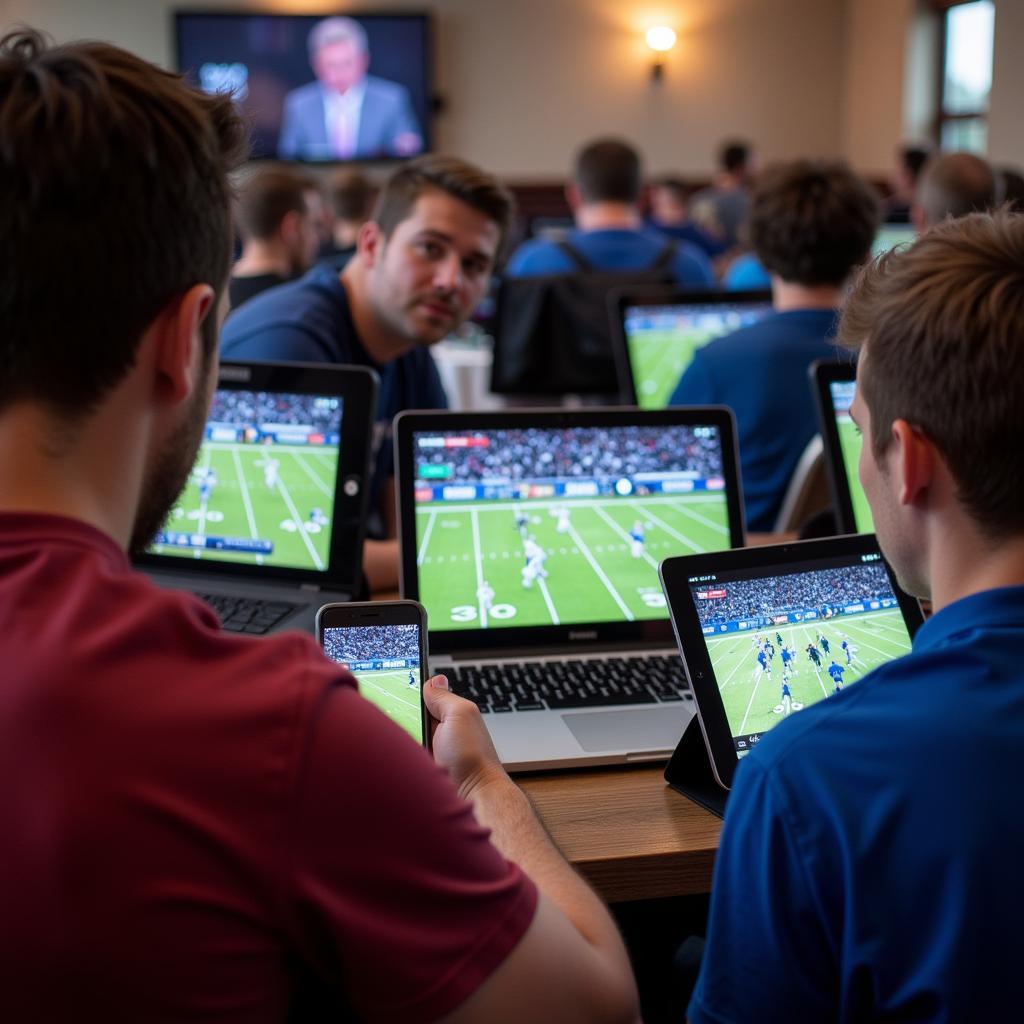 Delaware Valley vs. Wesley College Football Live Stream: Image showing fans watching the game on various devices.