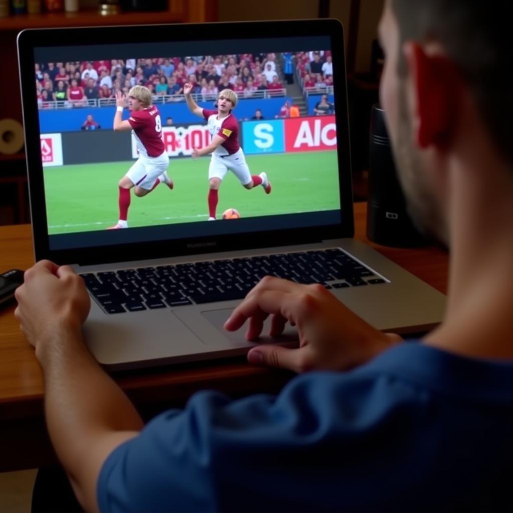 AAF Football Fan Enjoying the Game on Laptop