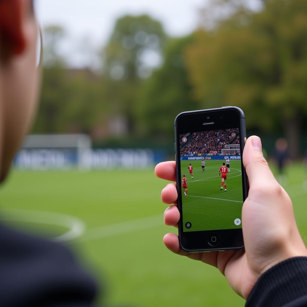 Watching football highlights on a mobile phone